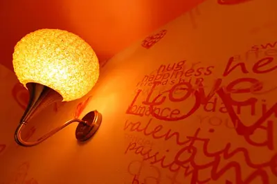 a lamp on a wall with writing on it at HOTEL555 \u9326\u7cf8\u753a in Tokyo