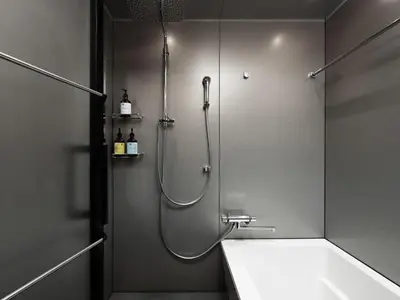 a bathroom with a shower and a sink at MIMARU Tokyo Station East in Tokyo