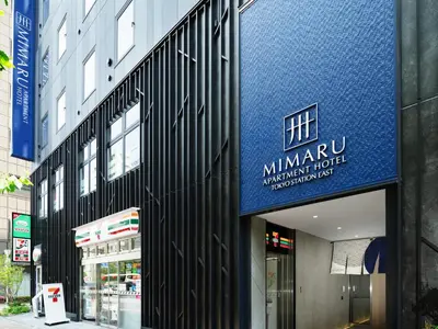 a building with a blue sign on the side of it at MIMARU Tokyo Station East in Tokyo