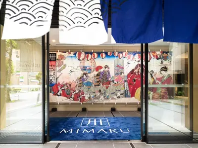 a store front with a mural in the window at MIMARU Tokyo Kinshicho in Tokyo