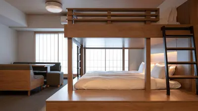 a bedroom with a bunk bed and a living room at MIMARU Tokyo Kinshicho in Tokyo