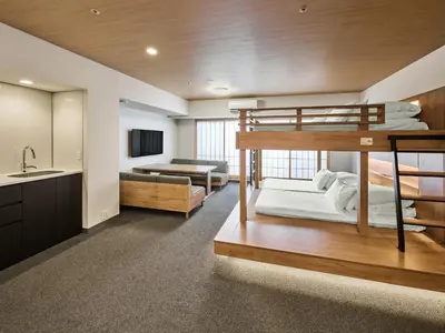 a room with two bunk beds and a kitchen at MIMARU Tokyo Kinshicho in Tokyo