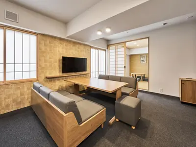 a conference room with a table and chairs and a television at MIMARU Tokyo Kinshicho in Tokyo