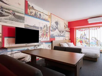 a room with a table and a tv and a bed at MIMARU Tokyo Kinshicho in Tokyo