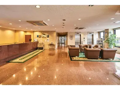 a lobby with chairs and a bar in a hotel at Urayasu Sun Hotel - Vacation STAY 33023v in Urayasu
