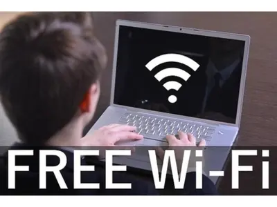a boy typing on a laptop with a wifi sign on it at Urayasu Sun Hotel - Vacation STAY 33015v in Urayasu