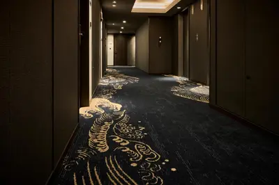 a hallway with a painting on the floor of a building at The Royal Park Canvas Ginza Corridor in Tokyo