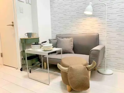 a living room with a couch and a table and a chair at KIKO HOUSE - Vacation STAY 42460v in Tokyo