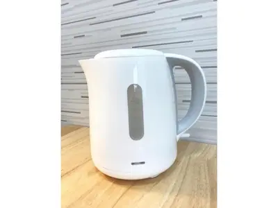 a white electric kettle sitting on a wooden floor at KIKO HOUSE - Vacation STAY 42460v in Tokyo