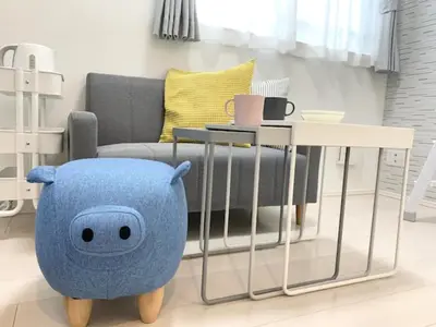 a blue pillow sitting next to a table in a living room at KIKO HOUSE - Vacation STAY 42464v in Tokyo