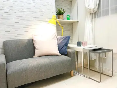 a living room with a couch and a table with a lamp at KIKO HOUSE - Vacation STAY 42467v in Tokyo