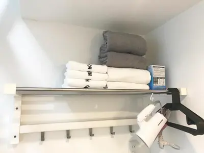 a shelf in a bathroom with towels on it at KIKO HOUSE - Vacation STAY 42467v in Tokyo