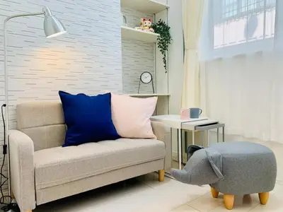 a living room with a couch and a stuffed elephant at KIKO HOUSE - Vacation STAY 42456v in Tokyo