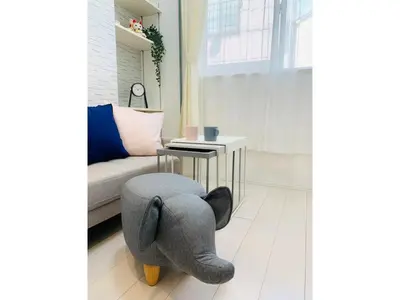 a stuffed elephant sitting on the floor of a living room at KIKO HOUSE - Vacation STAY 42456v in Tokyo
