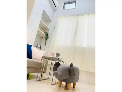 a gray chair sitting in a room with a window at KIKO HOUSE - Vacation STAY 42456v in Tokyo