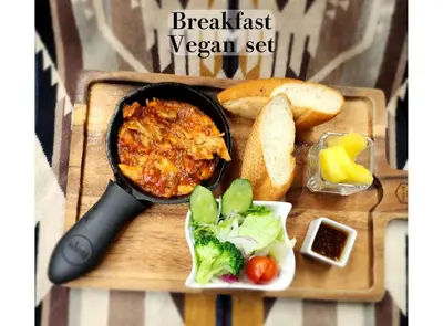 a plate of food with a pot of food and vegetables at Hotel BaliAn Resort Shinjuku Glamping in Tokyo