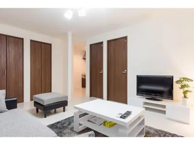 a living room with a couch and a tv at Gracias Arakawa - Vacation STAY 81702v in Tokyo