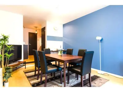 a dining room with a wooden table and chairs at Gracias Shibuya Honmachi - Vacation STAY 81716v in Tokyo