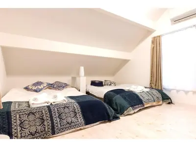 two beds sitting next to each other in a room at Gracias Shibuya Honmachi - Vacation STAY 81716v in Tokyo