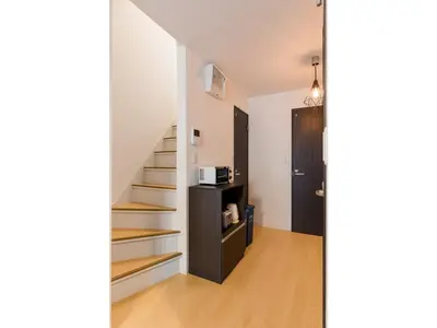 a hallway with a staircase in a house at Gracias Shibuya Honmachi - Vacation STAY 81716v in Tokyo