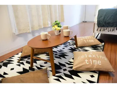 a table with two cups on top of a rug at Gracias Shibuya Honmachi - Vacation STAY 81716v in Tokyo
