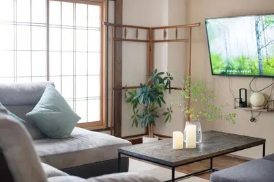 a living room with a couch and a coffee table at \u3077\u3075\u304b\u5c0f\u6885 in Tokyo