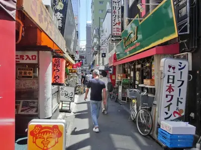 a man walking down a street in a city at Hotel Estasia Ryogoku in Tokyo