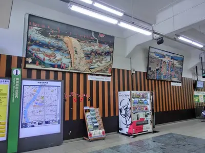 a room with three refrigerators and a large poster on the wall at Hotel Estasia Ryogoku in Tokyo