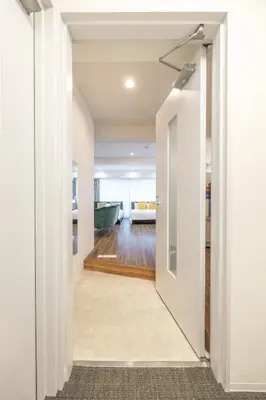an open hallway with a door leading to a living room at Hotel Estasia Ryogoku in Tokyo