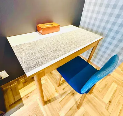 a table with a blue chair and a box on it at TIME SHARING STAY Ikebukuro in Tokyo