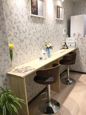 a desk with two stools in a room with wallpaper at My Home in Tokyo - Vacation STAY 73241v in Tokyo