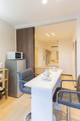 a kitchen and living room with a table and chairs at My Home in Tokyo - Vacation STAY 73241v in Tokyo
