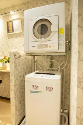 a microwave sitting on top of a refrigerator at My Home in Tokyo - Vacation STAY 73238v in Tokyo