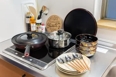 a stove top with pots and pans on top of it at My Home in Tokyo - Vacation STAY 73238v in Tokyo