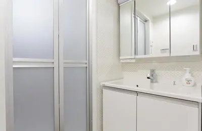 a white bathroom with a shower and a sink at HOTEL ESTASIA Ryogoku - Vacation STAY 53008v in Tokyo