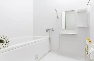 a white bathroom with a bathtub and a mirror at HOTEL ESTASIA Ryogoku - Vacation STAY 53008v in Tokyo