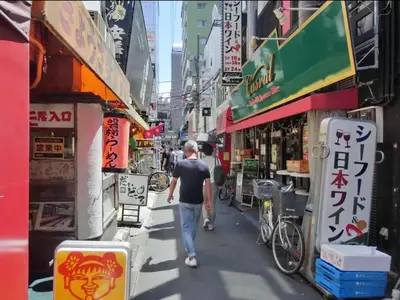 a man walking down a street in a city at HOTEL ESTASIA Ryogoku - Vacation STAY 53008v in Tokyo