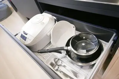 a kitchen sink with a pot and a strainer at Ciel-home in Tokyo