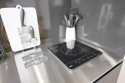 a kitchen counter with a knife and utensils at Ciel-home in Tokyo