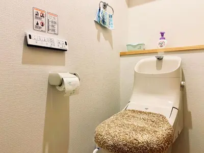 a small bathroom with a toilet in a room at K.House in Tokyo