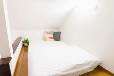 a bedroom with a white bed in a room at Near Ikebukuro, Kitchen & Laundry, Fast Wi-Fi, 4min to Station,Many restaurants nearby!! in Tokyo
