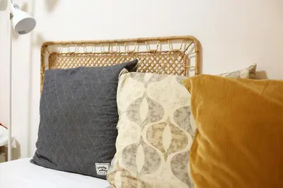 a bed with two pillows on top of it at GM Shinjuku in Tokyo