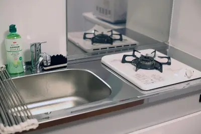 a kitchen sink with a bug on a counter at GM Shinjuku in Tokyo