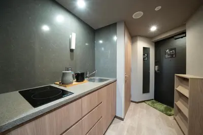 a kitchen with a sink and a counter top at KOKO HOTEL Residence Asakusa Kappabashi in Tokyo
