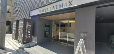 a store front of a building with a sign on it at HOTEL LiVEMAX Kamata Ekimae in Tokyo