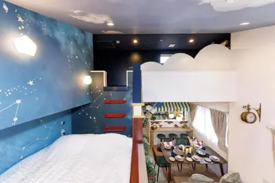 a childrens room with a cloud mural at Holy Town in Tokyo