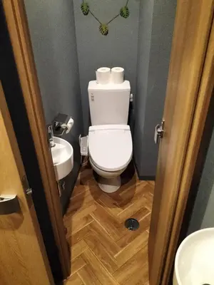 a bathroom with a toilet and a sink at bnb plus Ueno Park Female only in Tokyo