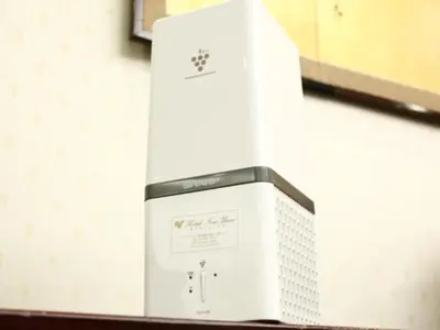 a white appliance on a wall in a kitchen at Hotel New Ueno in Tokyo