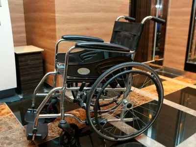 a wheelchair sitting on a counter in a room at APA Hotel Asakusa Kuramae Ekimae in Tokyo
