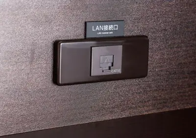 a lightswitch on the side of a wall at APA Hotel Asakusabashi Ekimae in Tokyo